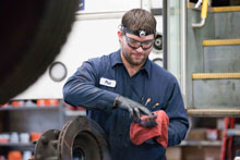 Photograph of Philip working on bus